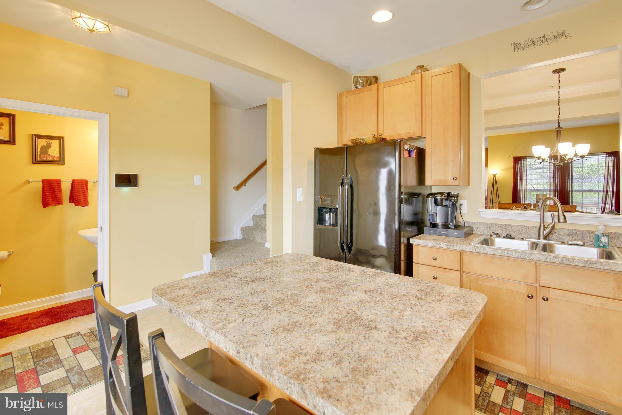 1924 Waltman Road Edgewood, MD 21040 - Photo 5 of 33 a kitchen with stainless steel appliances granite countertop a sink refrigerator and cabinets