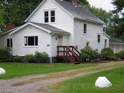 Front view. New deck at entrance. Newly landscaped and painted