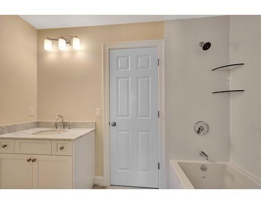 60 Bridge Street Needham, MA 02494 - Photo 17 of 28 a bathroom with a sink and a mirror