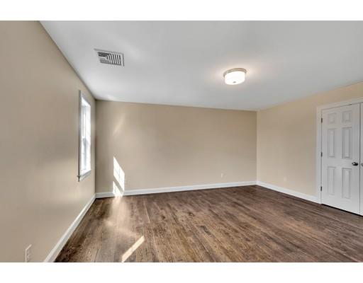 60 Bridge Street Needham, MA 02494 - Photo 20 of 28 a view of an empty room with wooden floor