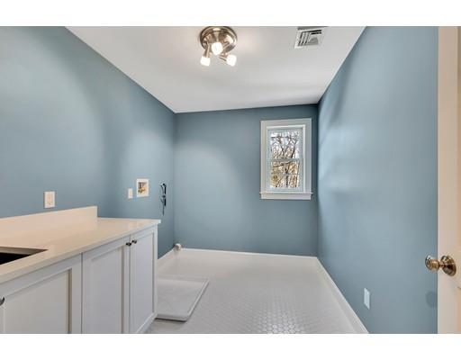 60 Bridge Street Needham, MA 02494 - Photo 21 of 28 a bedroom with a bed and a cabinets
