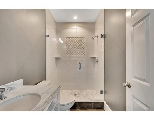 60 Bridge Street Needham, MA 02494 - Photo 5 of 28 a bathroom with a sink and a shower