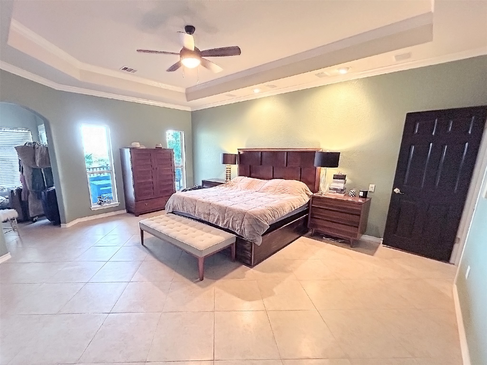 1015 Westland Ridge Road Dripping Springs, TX 78620 - Photo 15 of 32 A generously proportioned sleeping sanctuary features tray ceilings and recessed lighting.