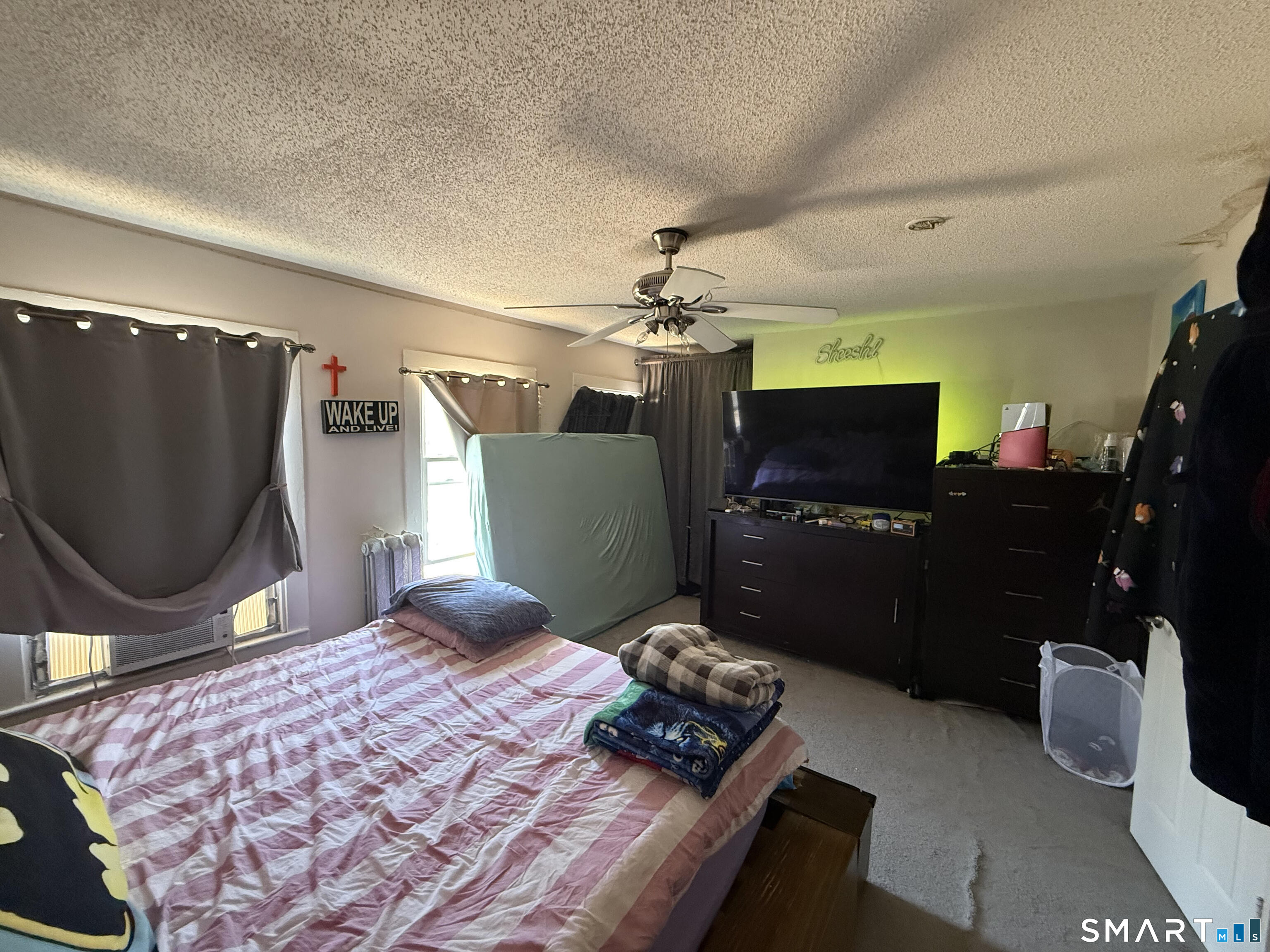 128 Hobart Street Meriden, CT 06450 - Photo 11 of 15 a bedroom with a bed and a mirror