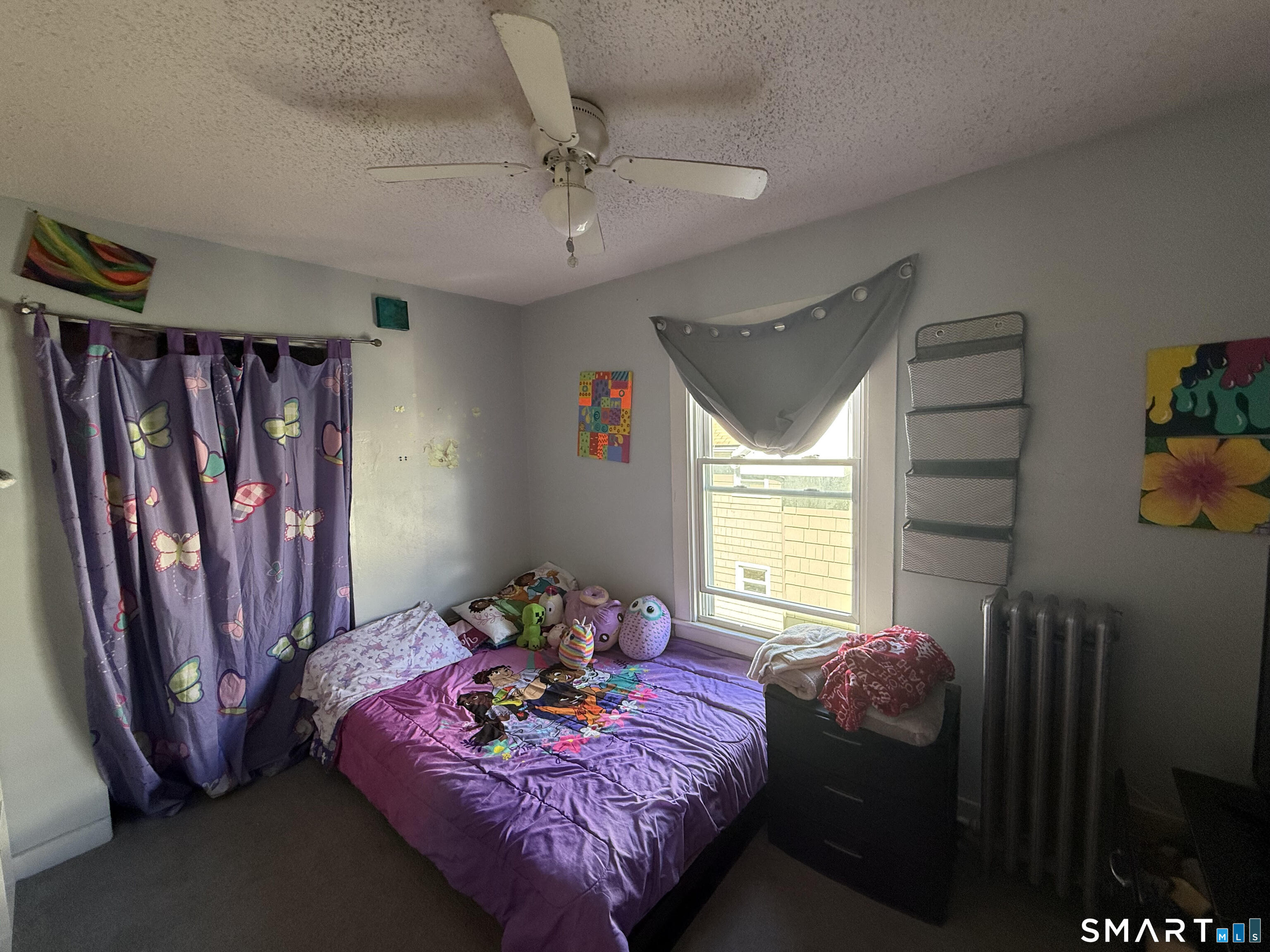 128 Hobart Street Meriden, CT 06450 - Photo 12 of 15 a bed room with a bed furniture and a window