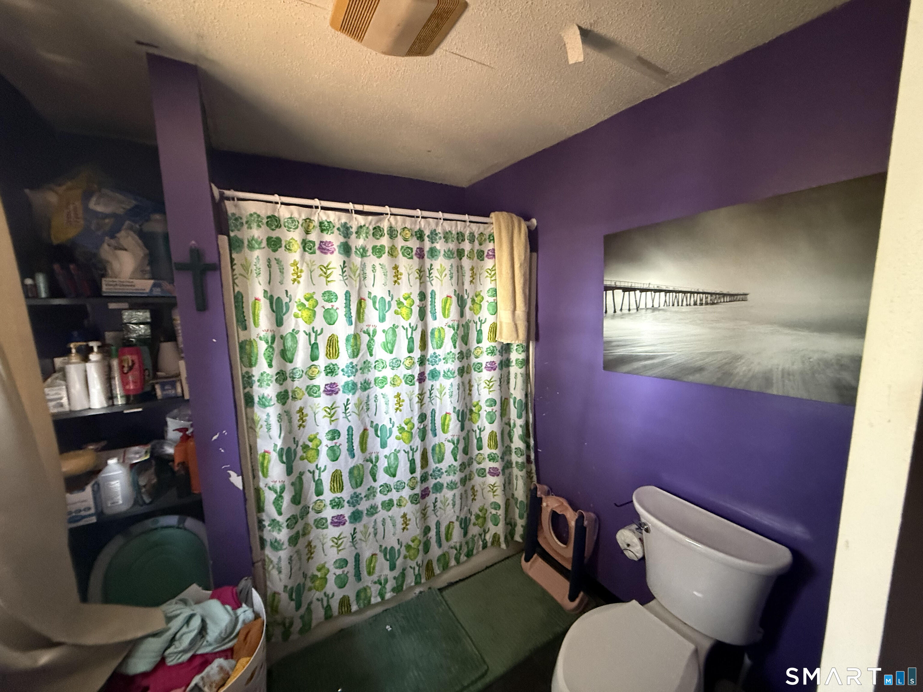 128 Hobart Street Meriden, CT 06450 - Photo 14 of 15 a bathroom with a toilet mirror vanity and window