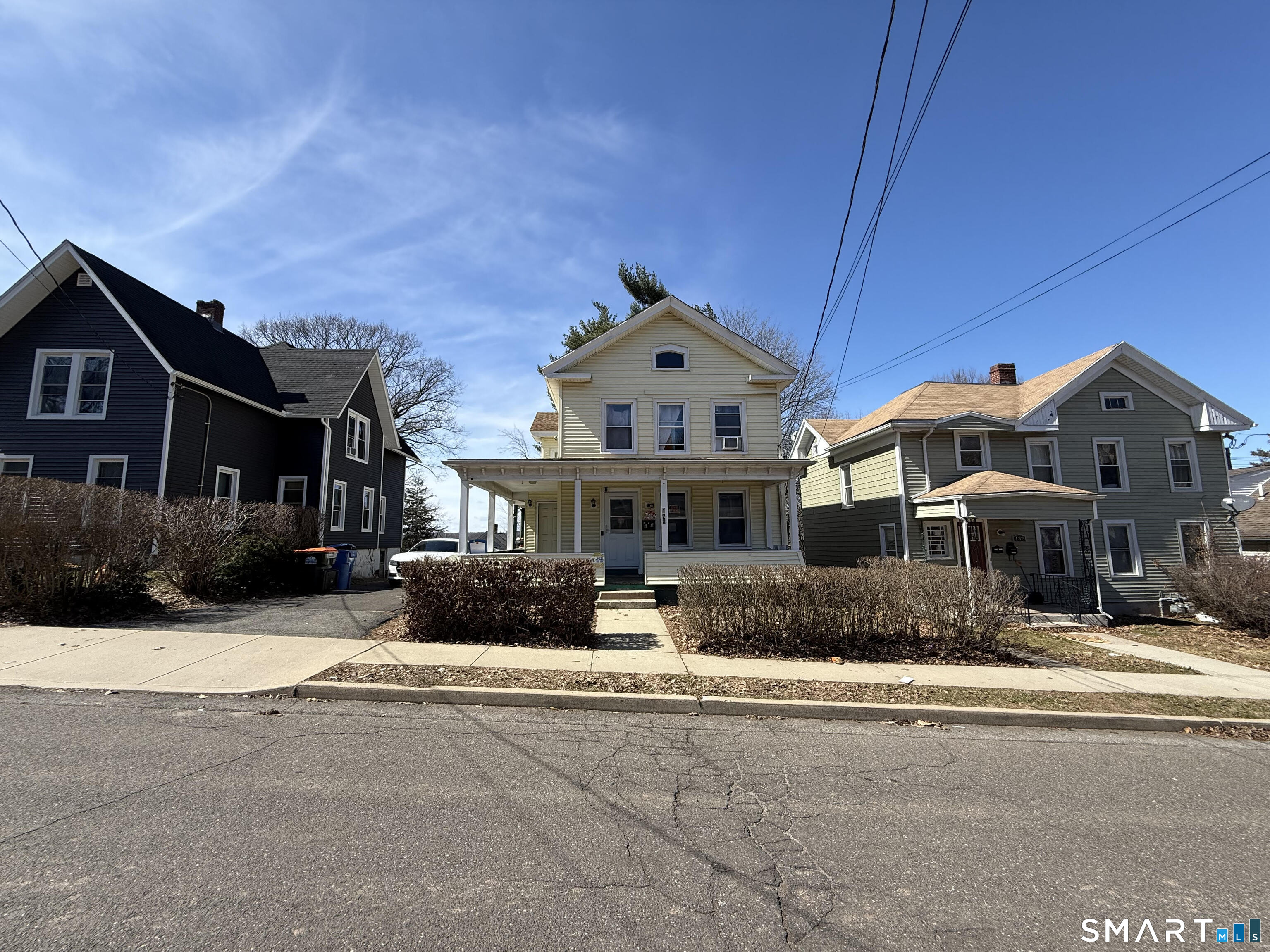 128 Hobart Street Meriden, CT 06450 - Photo 2 of 15 a front view of a house with a yard