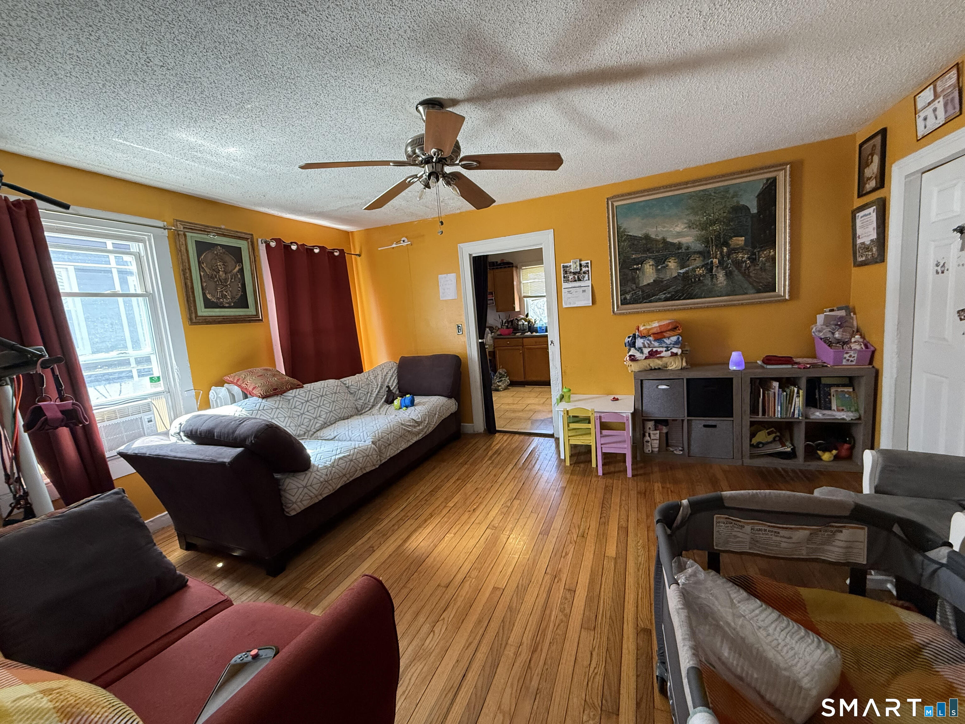128 Hobart Street Meriden, CT 06450 - Photo 7 of 15 a living room with furniture and wooden floor