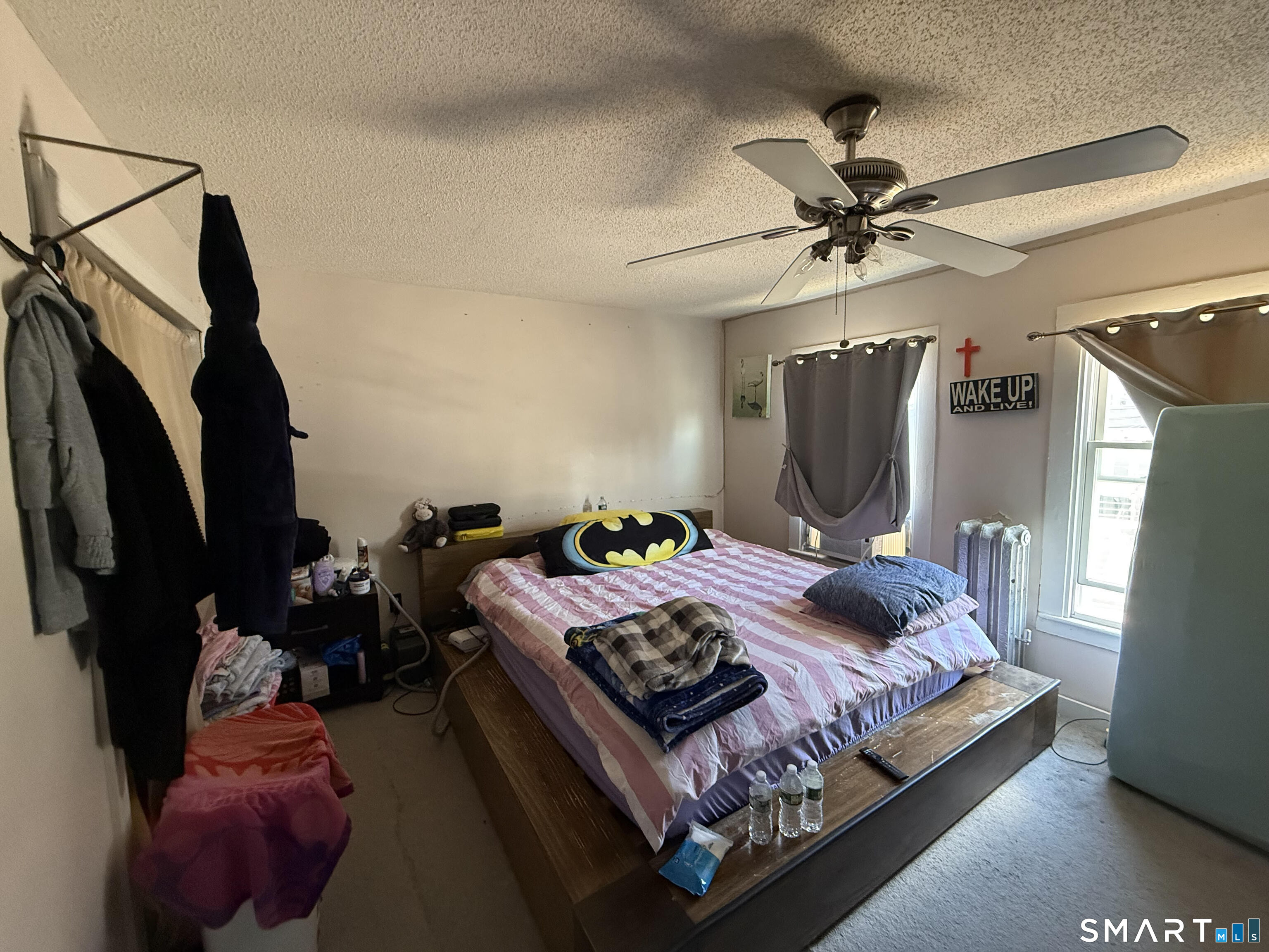 128 Hobart Street Meriden, CT 06450 - Photo 10 of 15 a bed room with a bed window and a mirror