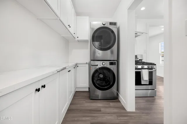 a view of a hallway with washer and dryer