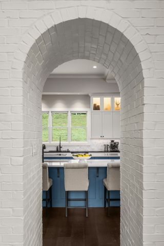 a living room with a fireplace and a window