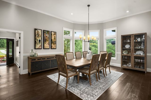 a kitchen that has a sink and a stove in it