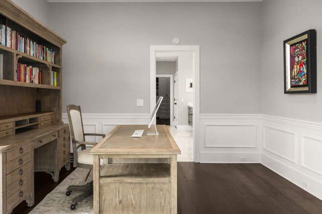 a bedroom with furniture and a flat screen tv