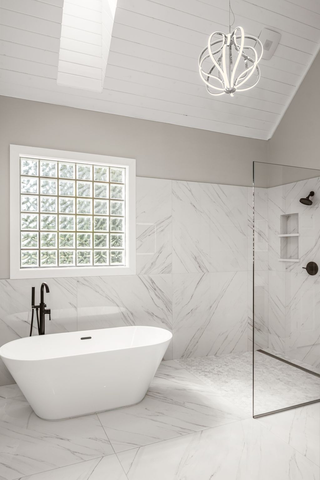 1026 Holly Tree Gap Road Brentwood, TN 37027 - Photo 28 of 71 a white bath tub sitting next to a window