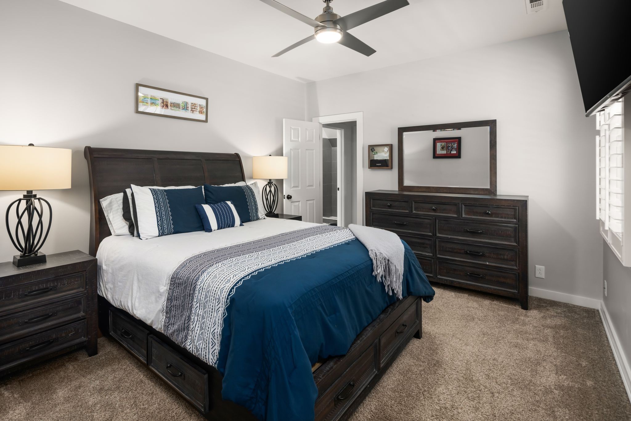 1026 Holly Tree Gap Road Brentwood, TN 37027 - Photo 33 of 71 a spacious bedroom with a bed and a flat screen tv
