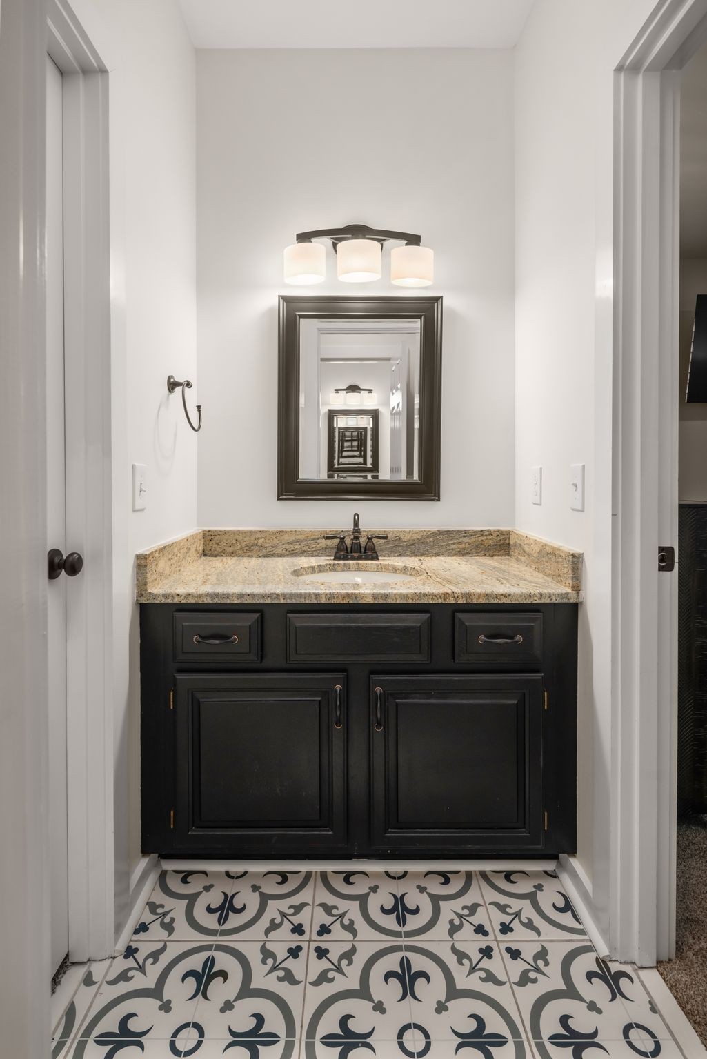 1026 Holly Tree Gap Road Brentwood, TN 37027 - Photo 36 of 71 a bathroom with a sink and a mirror
