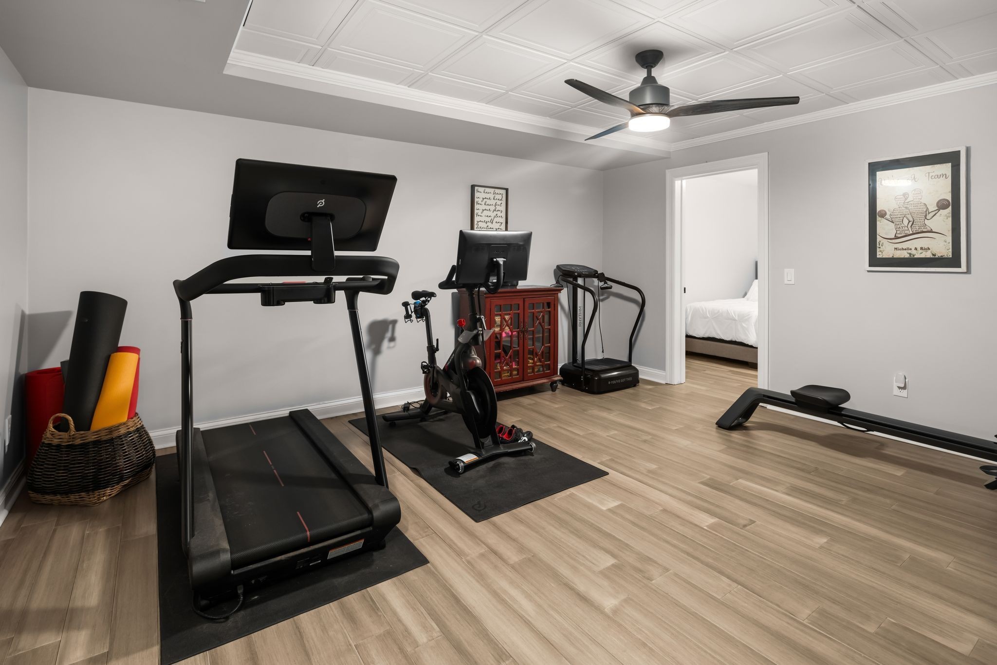 1026 Holly Tree Gap Road Brentwood, TN 37027 - Photo 39 of 71 a room with gym equipment and wooden floor