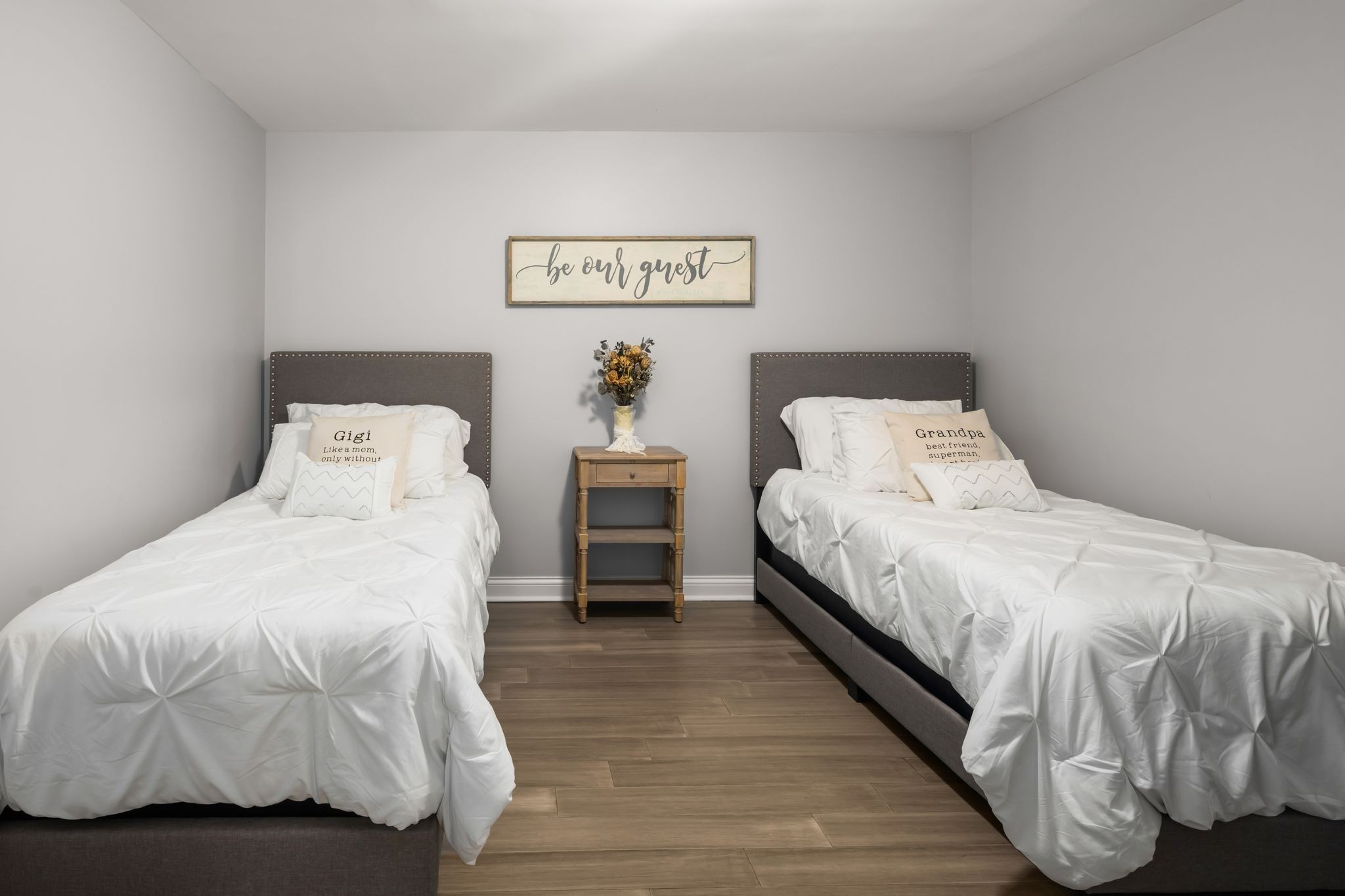 1026 Holly Tree Gap Road Brentwood, TN 37027 - Photo 40 of 71 a bedroom with a bed and wooden floor