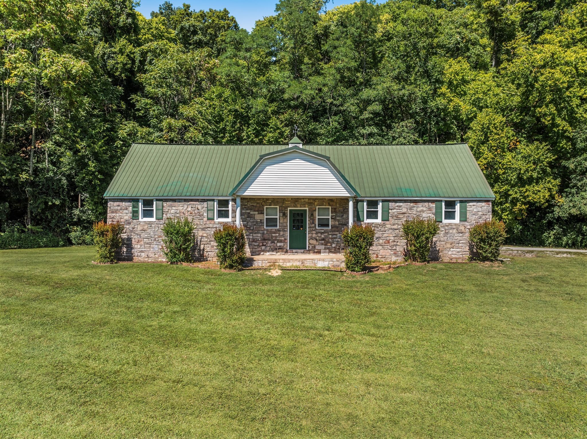 1026 Holly Tree Gap Road Brentwood, TN 37027 - Photo 53 of 71 a front view of a house with a garden