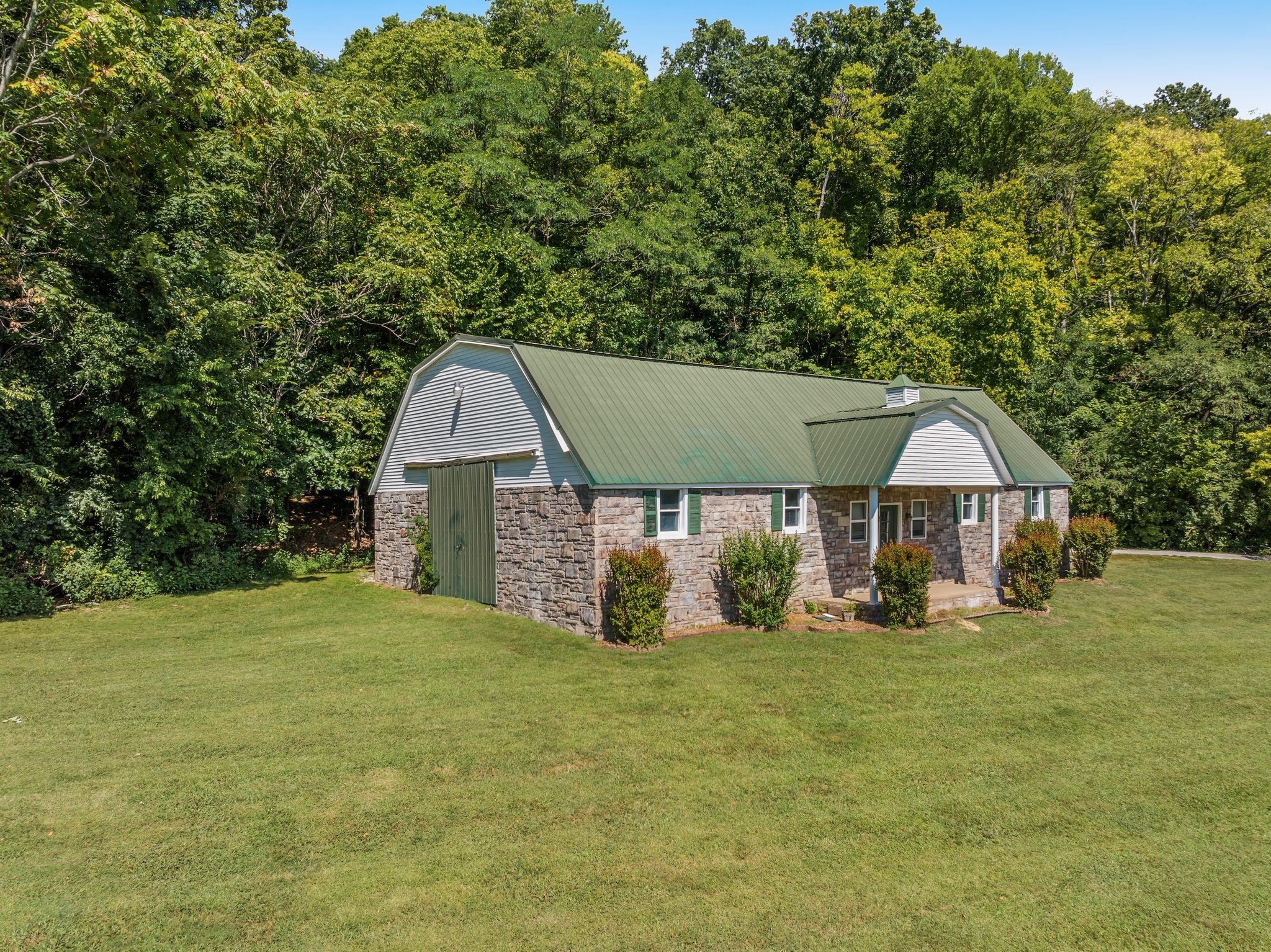 1026 Holly Tree Gap Road Brentwood, TN 37027 - Photo 58 of 71 a view of a house with a yard