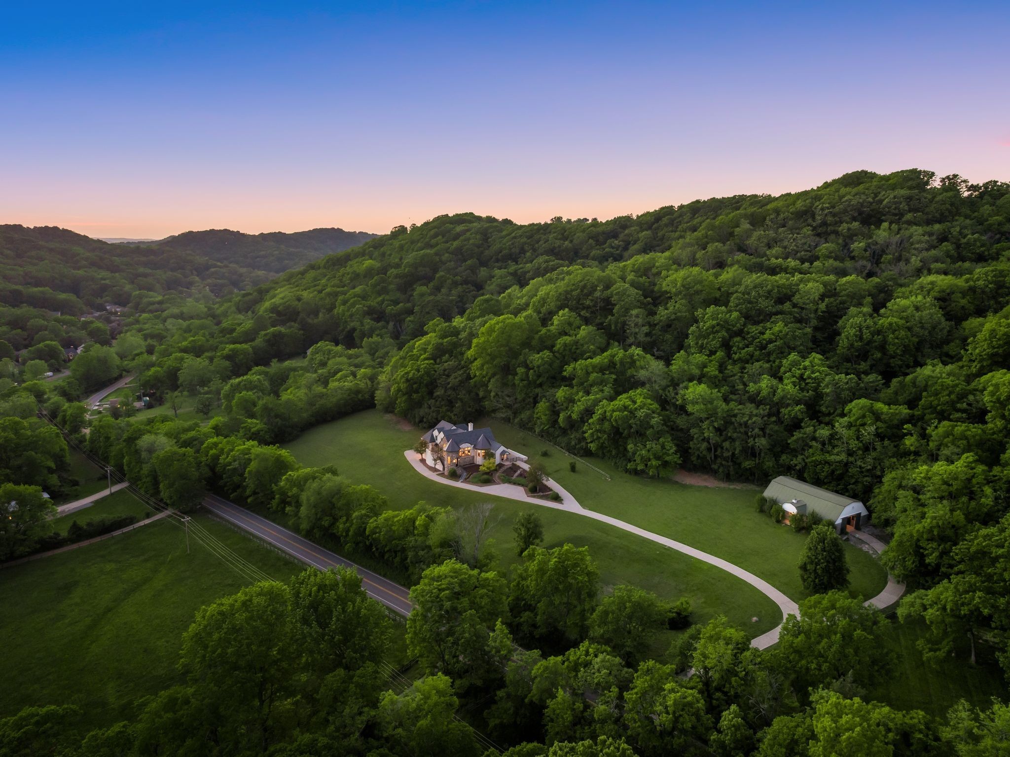 1026 Holly Tree Gap Road Brentwood, TN 37027 - Photo 64 of 71 a view of a lush green hillside and a mountain view
