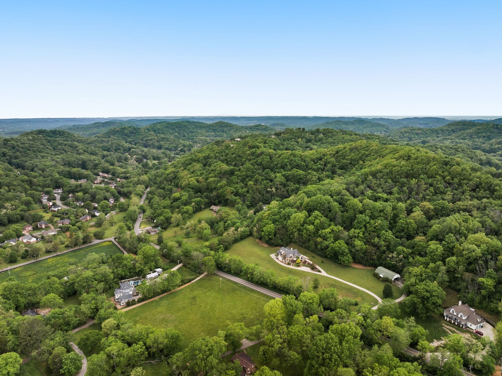 1026 Holly Tree Gap Road Brentwood, TN 37027 - Photo 67 of 71 an aerial view of residential houses with outdoor space and trees