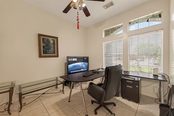 a bedroom with a bed couch and window
