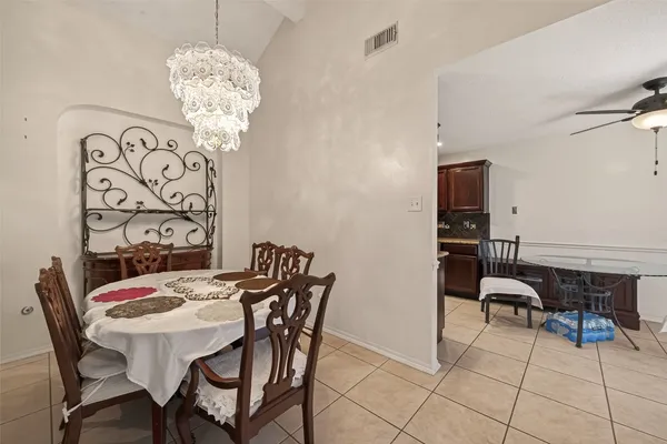 a kitchen with stainless steel appliances kitchen island granite countertop a sink and cabinets