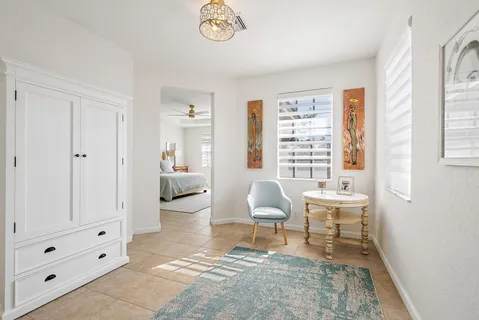 a large bathroom with a double vanity sink a mirror and a bathtub
