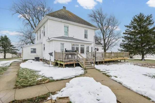 a view of a house with snow on the roof