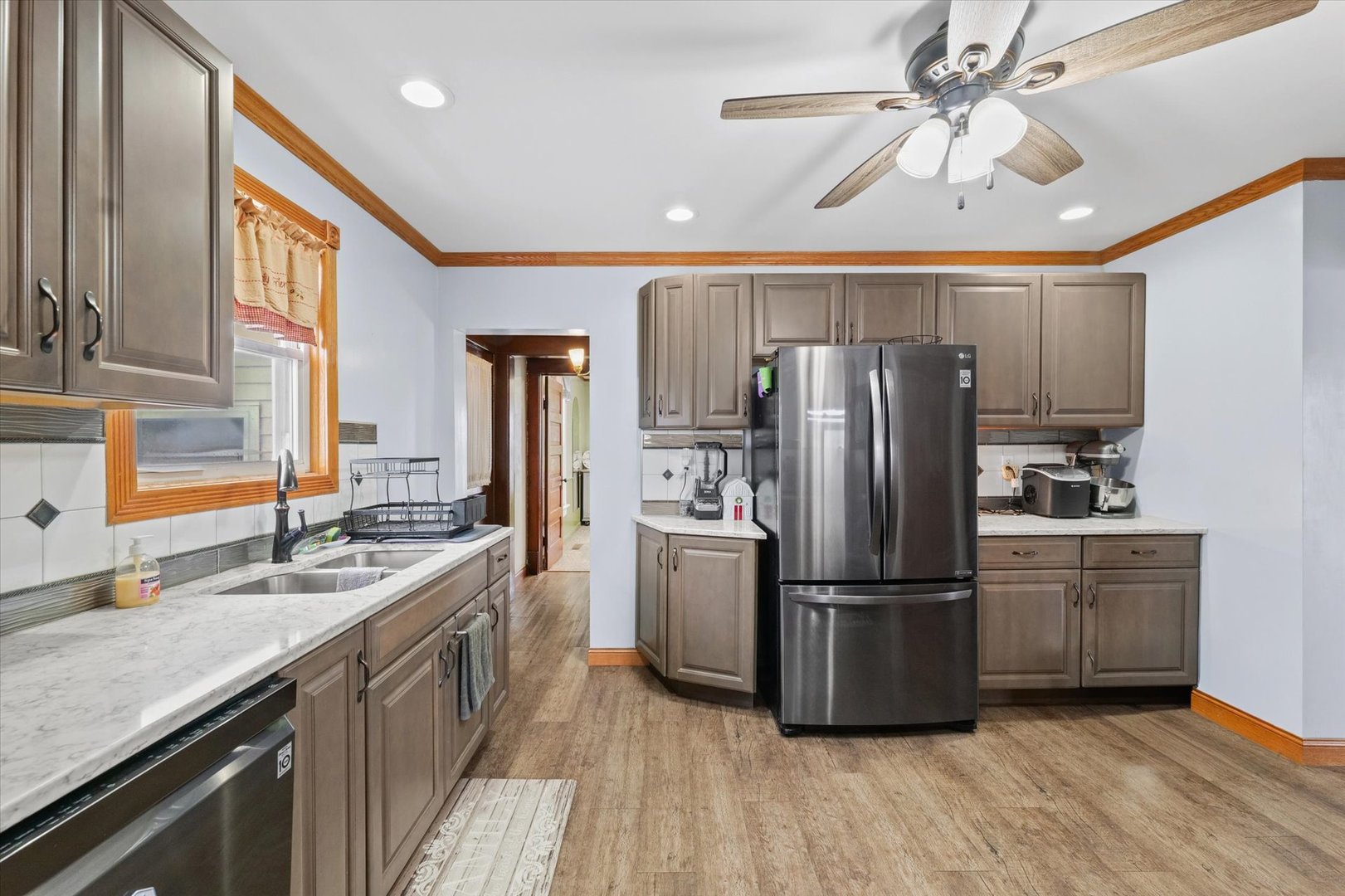 1636 East 1500 North Road Roberts, IL 60962 - Photo 11 of 49 a kitchen with refrigerator cabinets and a sink