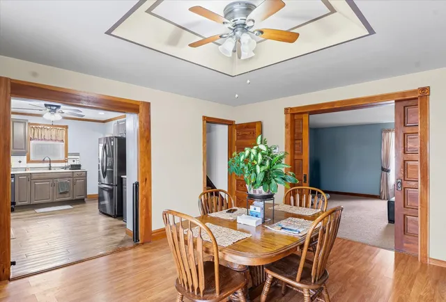 a view of a dining room with furniture and wooden floor
