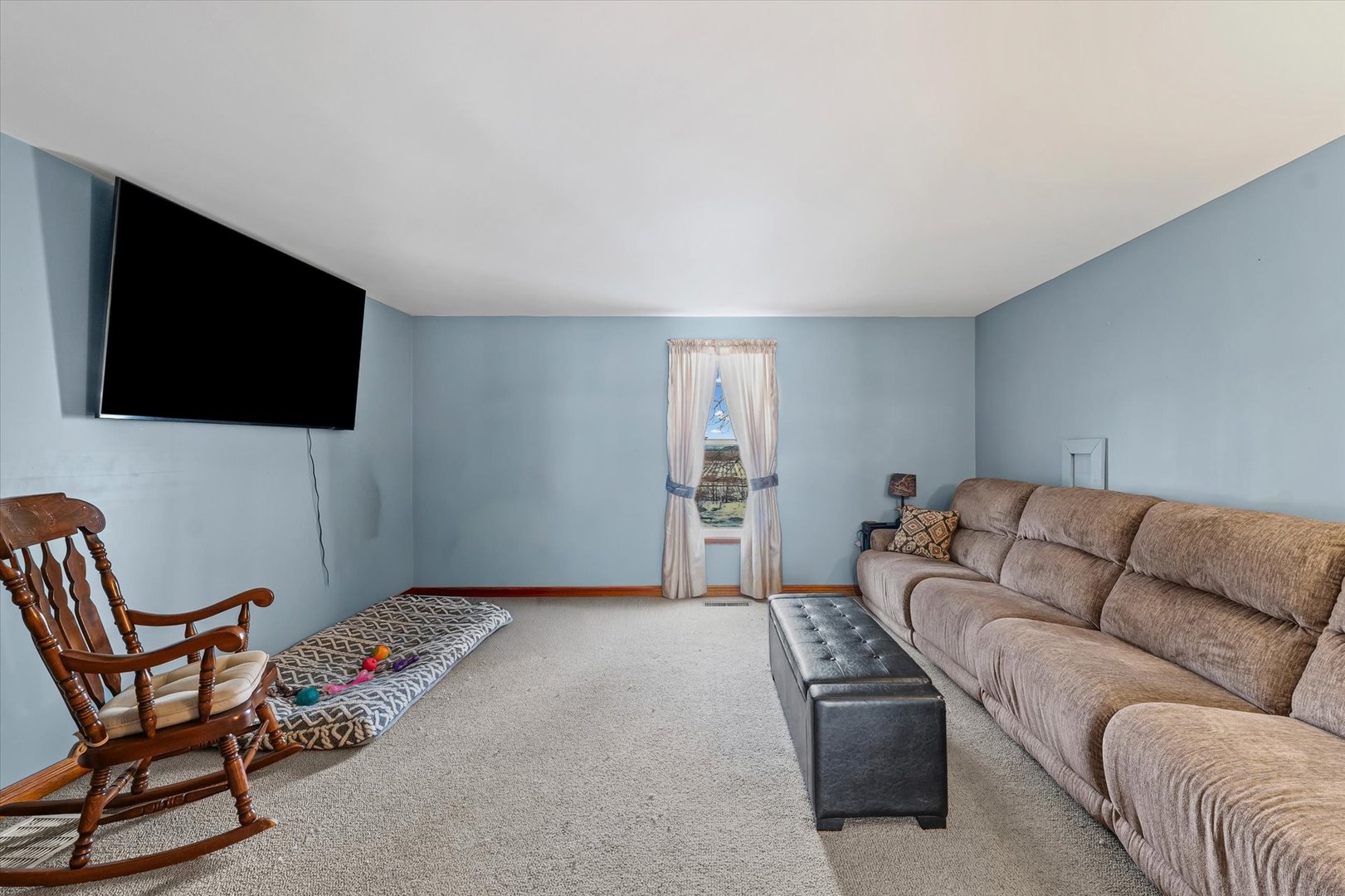 1636 East 1500 North Road Roberts, IL 60962 - Photo 17 of 49 a living room with furniture and a flat screen tv