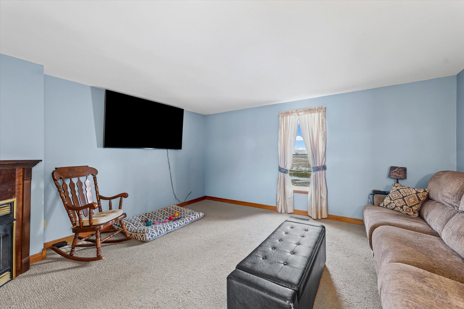 1636 East 1500 North Road Roberts, IL 60962 - Photo 18 of 49 a living room with furniture and a flat screen tv