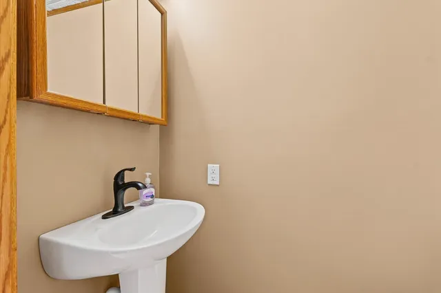 a view of walk in closet and bathroom