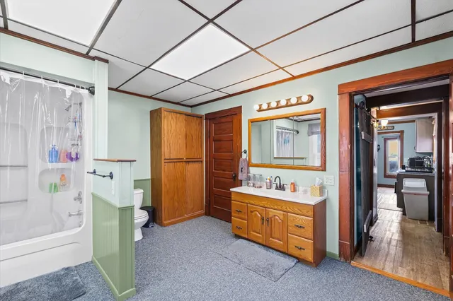 a view of a hallway with windows