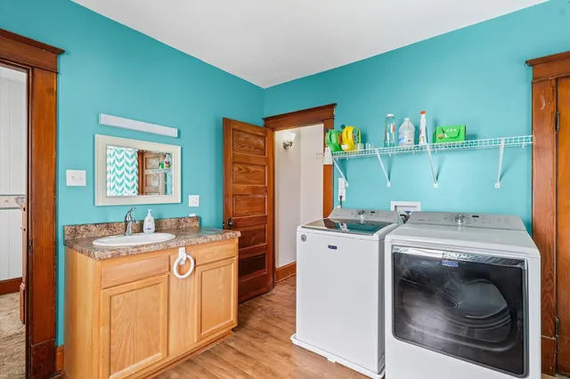 a toilet sitting in a bathroom next to a wooden wall