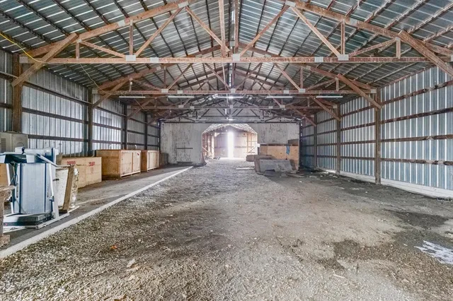 a front view of a house with yard and ocean view