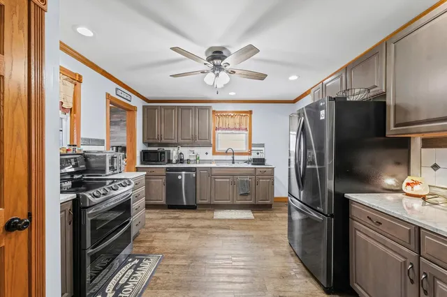 a kitchen with a refrigerator a sink and dishwasher