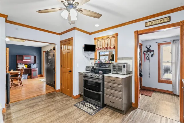 a kitchen with stainless steel appliances granite countertop a stove and a refrigerator