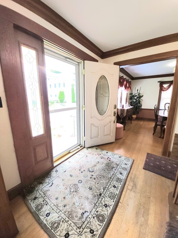 96 Brook Road Milton, MA 02186 - Photo 13 of 34 a living room with couch a rug and a large window