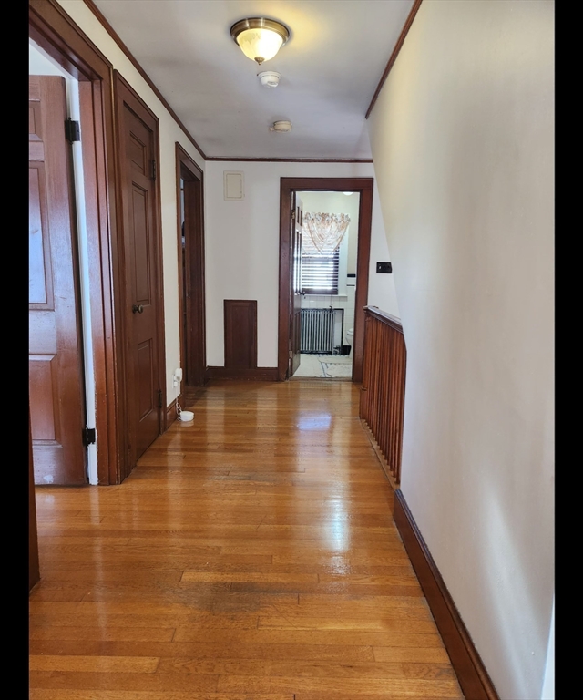 96 Brook Road Milton, MA 02186 - Photo 15 of 34 a view of a hallway with wooden floor