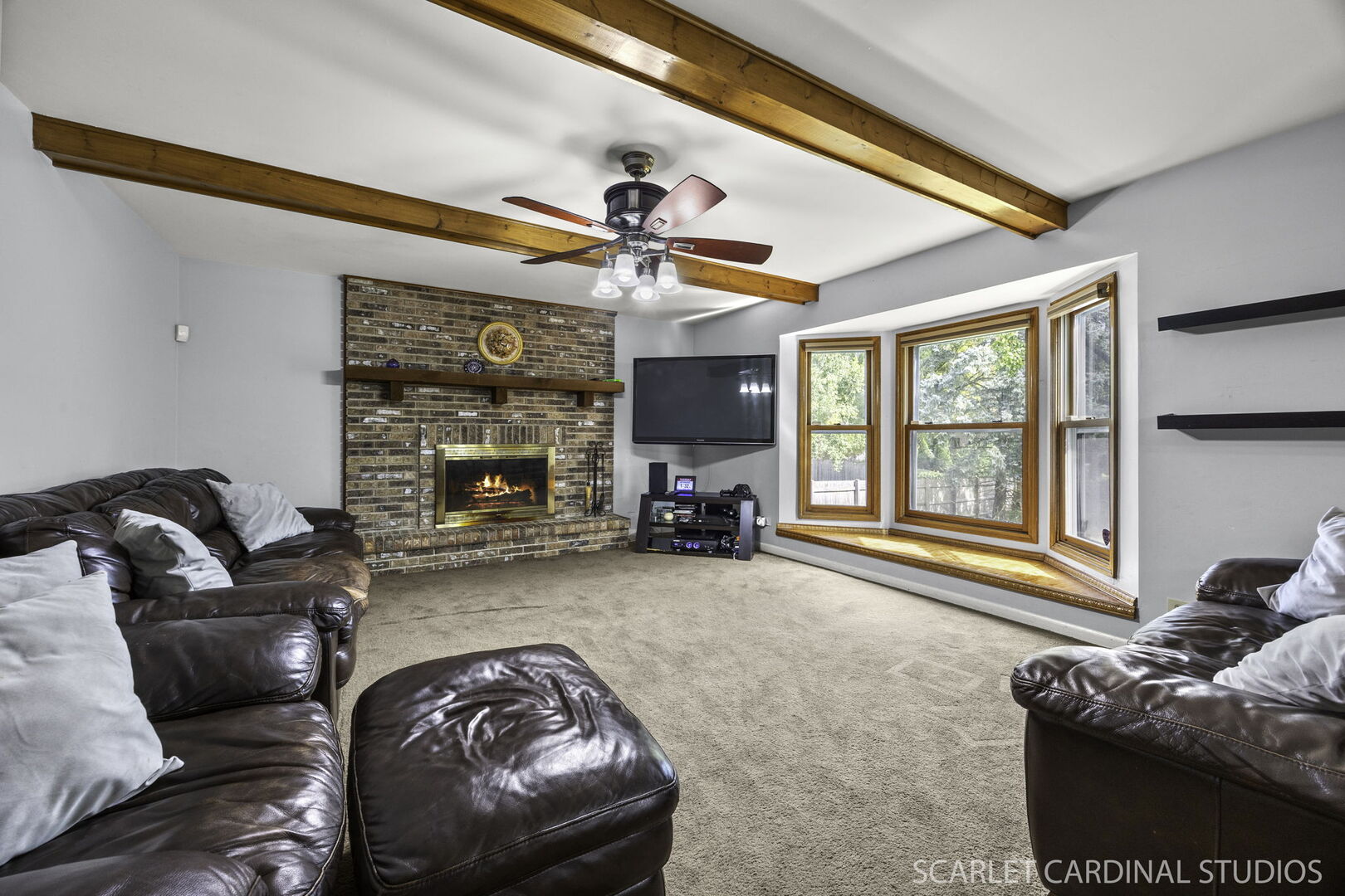 912 Sanctuary Lane Naperville, IL 60540 - Photo 12 of 31 a living room with furniture and a fireplace