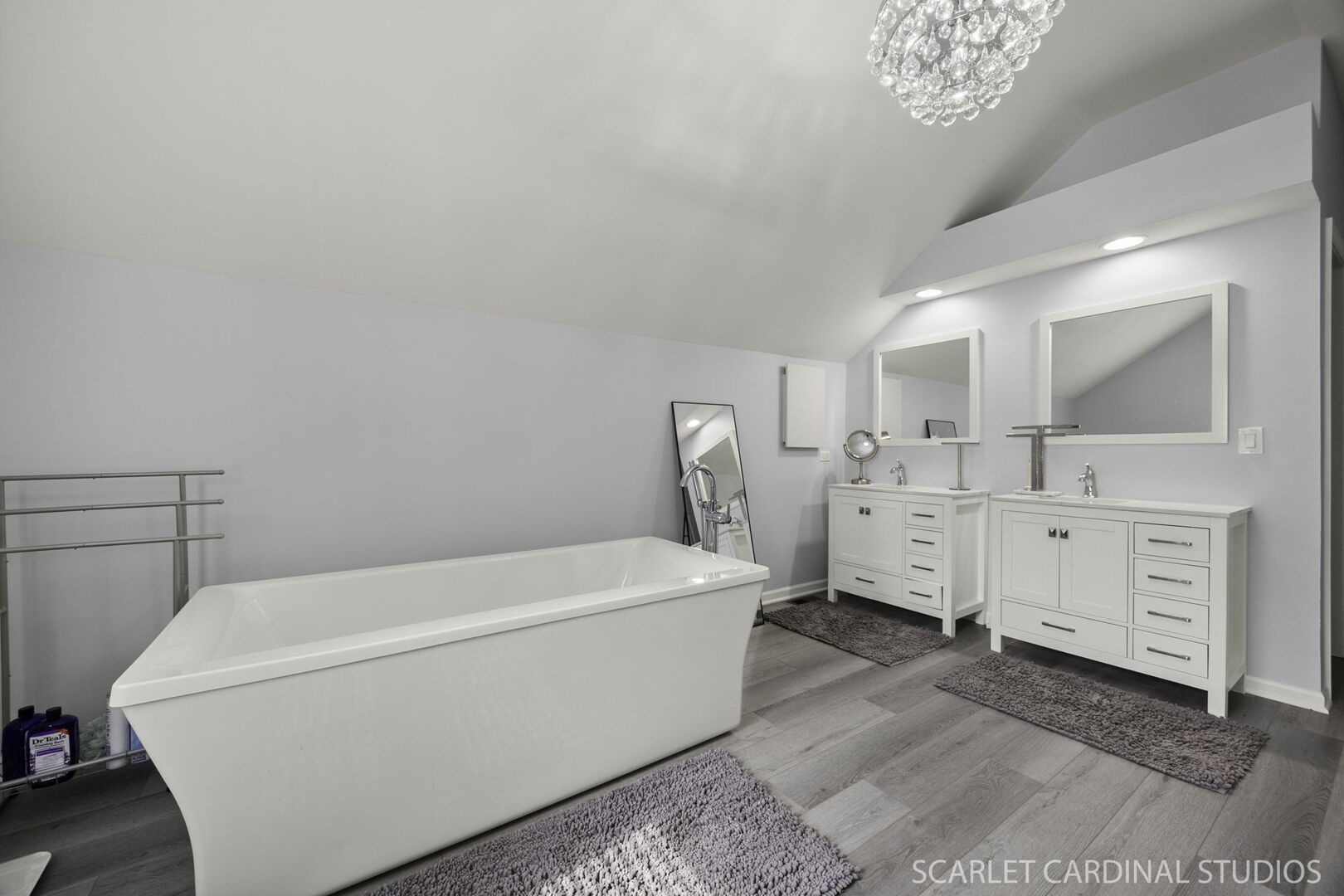 912 Sanctuary Lane Naperville, IL 60540 - Photo 16 of 31 a spacious bedroom with a bed a chandelier and a mirror