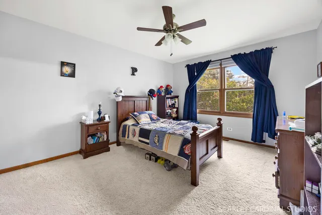 a bed room with a bed and a window