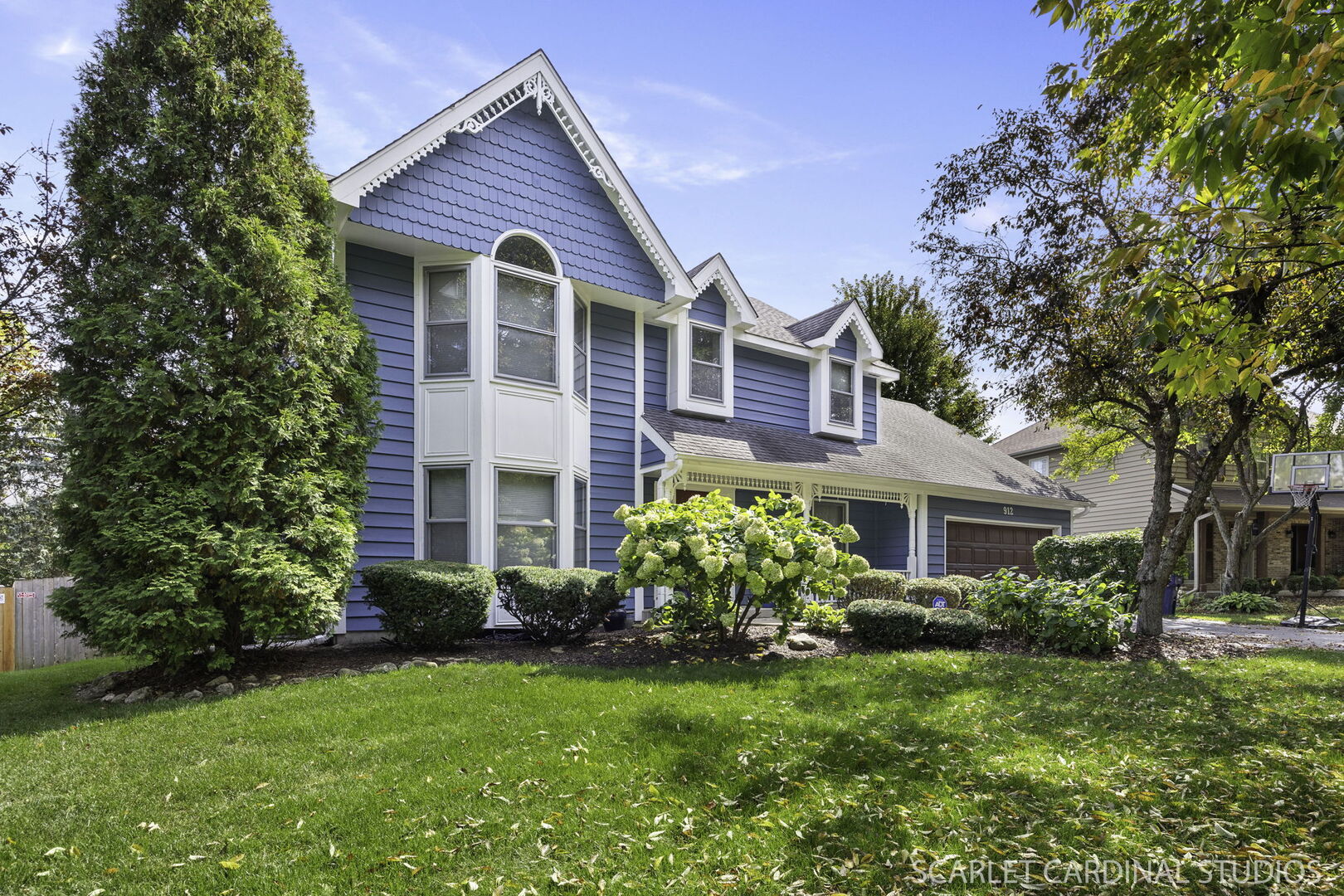 912 Sanctuary Lane Naperville, IL 60540 - Photo 2 of 31 a front view of a house with garden