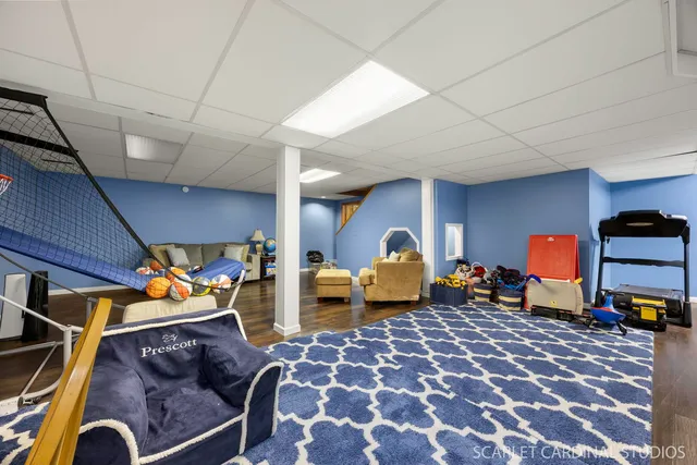 a bedroom with furniture and a tv