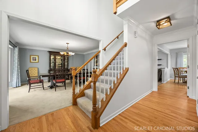 a view of entryway and dining room with furniture