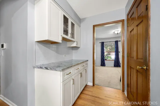 a kitchen with stainless steel appliances granite countertop a stove and a refrigerator