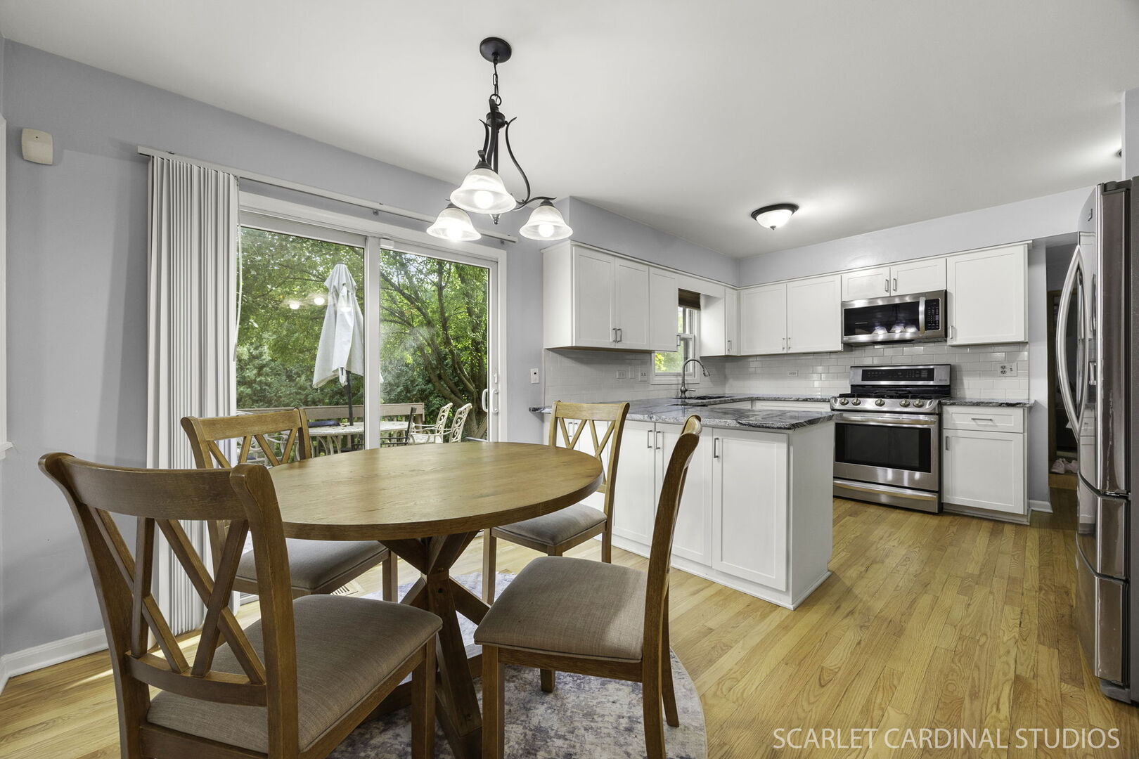 912 Sanctuary Lane Naperville, IL 60540 - Photo 10 of 31 a view of a dining room with furniture large window and wooden floor